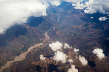 Fototapeta premium Aerial View - Clouds over Andes Mountains in Cusco, Peru