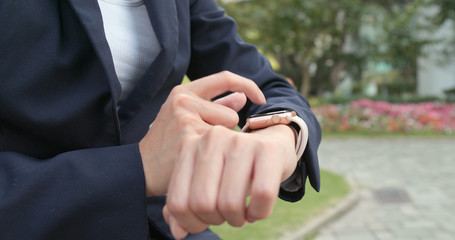 Businesswoman using smart watch
