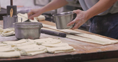 Chef making sesame bread in restaurant