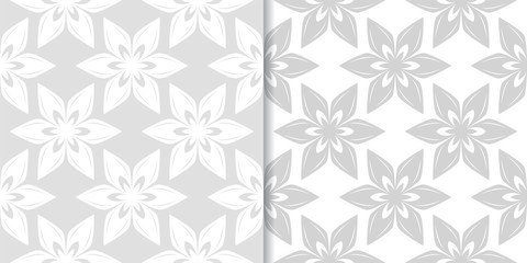 Light gray floral ornaments. Set of seamless patterns