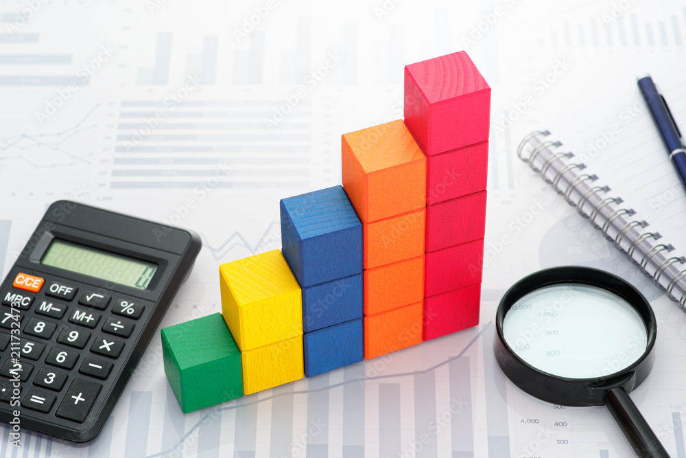 Poster Analyzing data. Gathering statistics. Business data processing. Toy block steps, calculator and magnifier on many charts background.

