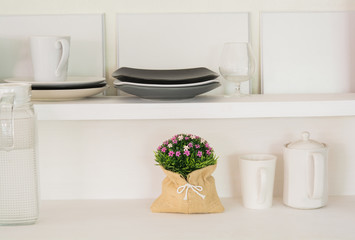Lovely plastic flower bouquet in the wood kitchen.