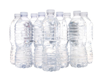 Plastic bottles of water isolated on white. A new study of 259 water bottles has found tiny pieces...