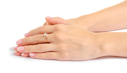 Female hand with a gold ring on a white background isolation