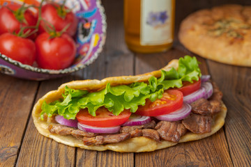 background,barbecue,beef,bread,cabbage,chicken,closeup,dinner,donner,döner,fast,food,greek,green,grilled,gyro,hamburger,health,healthy food,kebab,kebap,lettuce,lunch,meal,meat,onion,orange,pita,roast,