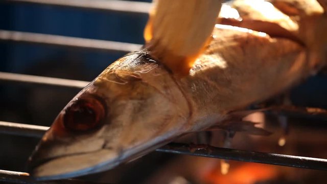Grilled barbecue saba fish cooking  on fire grill