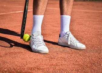 Fototapeta na wymiar Young man playing tennis