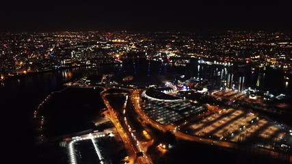 Aerial drone bird's eye view night shot of iconic O2 Arena as seen from Greenwich Peninsula, Isle...
