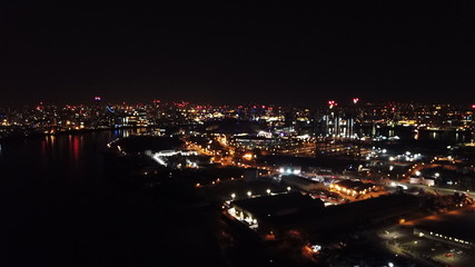 Fototapeta na wymiar Aerial bird's eye view photo taken by drone of famous Canary Wharf skyscraper complex, Isle of Dogs, London, United Kingdom