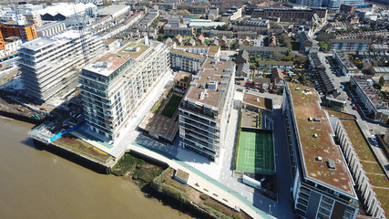 Aerial bird's eye view photo taken by drone of Greenwich village residential area by river Thames, London, United Kingdom