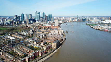 Aerial bird's eye view photo taken by drone of famous Docklands and Canary Wharf skyscraper...