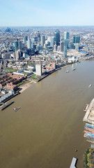 Aerial bird's eye view photo taken by drone of famous Docklands and Canary Wharf skyscraper...