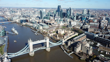 Aerial drone bird's eye view of iconic fortified Tower of London next to Tower bridge in City of...