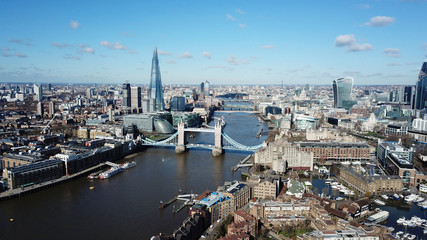 Fototapeta premium Aerial drone bird's eye view of iconic Tower Bridge, the Shard and skyline in City of London, United Kingdom