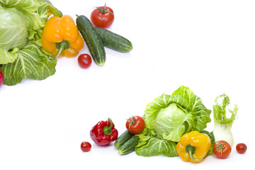 Green cabbage. Yellow pepper. Red tomatoes and cucumbers on a white background.