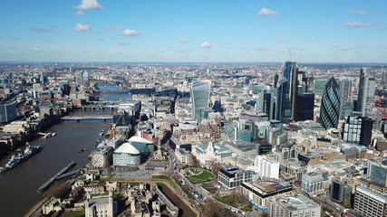 Fototapeta premium Aerial drone bird's eye view of iconic skyline in City of London as seen from St Katharine Docks Marina, London, United Kingdom