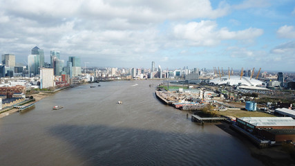 Naklejka premium Aerial bird's eye view photo taken by drone of famous Docklands and Canary Wharf skyscraper complex, Isle of Dogs, London, United Kingdom
