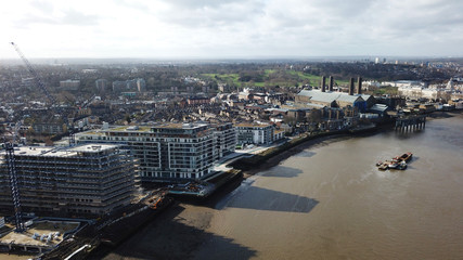 Aerial bird's eye view photo taken by drone of Greenwich village residential area by river Thames, London, United Kingdom