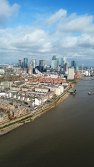 Aerial bird's eye view photo taken by drone of famous Docklands and Canary Wharf skyscraper...