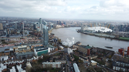 Aerial bird's eye view photo taken by drone of famous Docklands and Canary Wharf skyscraper complex, Isle of Dogs, London, United Kingdom