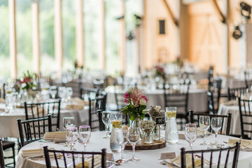wedding table set up decoration with flowers and glasses