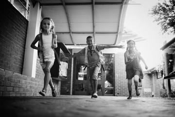 Kids running in school corridor