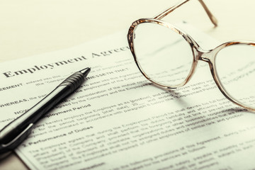 Close up shot of Eyeglasses  on document papers business concept