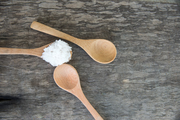 Spoon wood on wooden texture.