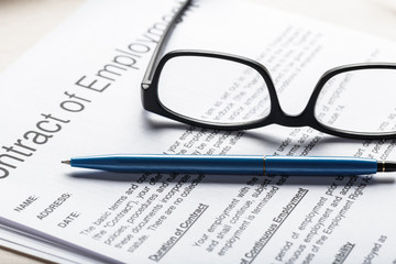 Close up shot of Eyeglasses  on contract document papers business concept