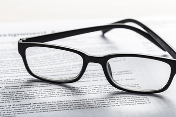 Close up shot of Eyeglasses  on document papers business concept