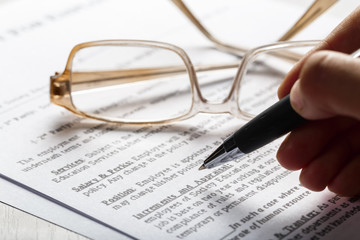 Close up shot of Eyeglasses  on document papers business concept