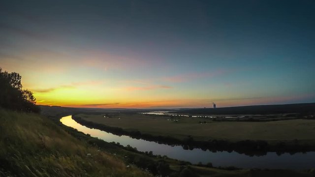 Beautiful nature landscape panorama sunset time lapse with dramatic sky and river in valley, toned