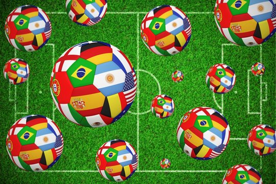 Composite image of footballs in international flags