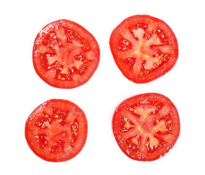 Fresh red tomato slices isolated on white background, top view