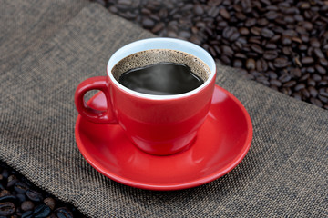 coffee cup on coffee beans