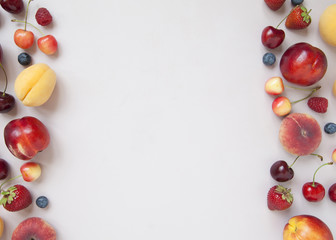Naklejka na ściany i meble Variety of fresh juicy berries and fruits. Minimal food frame.