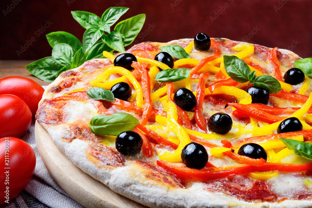 Wall mural Pizza with tomato, mozzarella, peppers, olives, extra virgin and basil