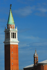 San Giorgio Maggiore (Saint George Major)  tall bell tower with dark angel statue at the top, erected in 1791 in Venice (with copy space)