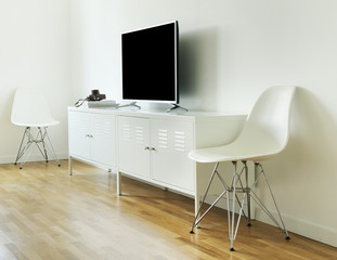 Modern Smart Tv Mockup on stand, white living room.