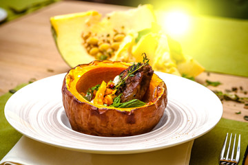 beautiful flow in the restaurant, baked pumpkin with beans and meat, beautiful food closeup