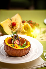 beautiful flow in the restaurant, baked pumpkin with beans and meat, beautiful food closeup