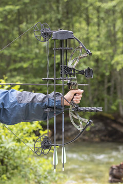 A Compound Bow And Arrow Drawn Close Up.