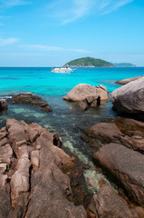 Fototapeta na wymiar Similan island and vibrant turquoise blue Andaman sea. Phang Nga - Phuket, Thailand