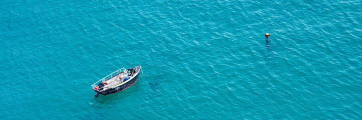 Small boat on the sea, panoramic aerial view,  in Guernsey