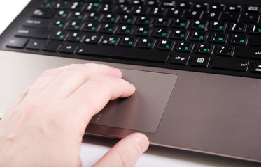 close up hands multitasking man using laptop connecting wifi