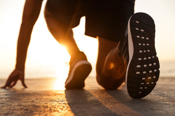 Back view of a sportsman getting ready to run