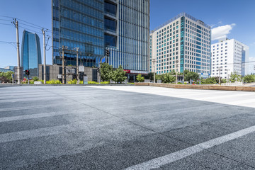 Fototapeta na wymiar Modern business office buildings with empty road,empty concrete square floor