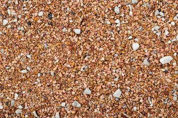 Red brown small gravel.
