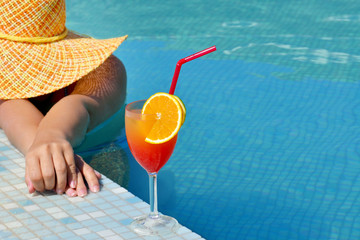 Real female beauty relaxing in swimming pool
