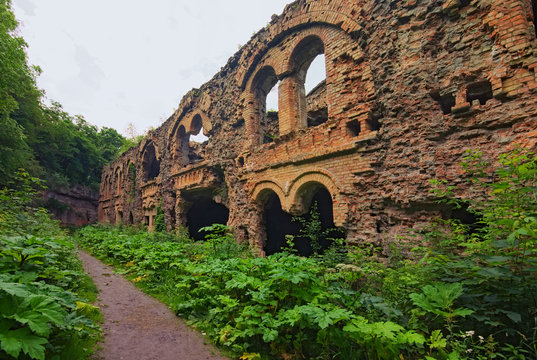 Ruins of buildings within in abandoned Tarakaniv Fort in the summer cloudy day. Rivne oblast, Ukraine